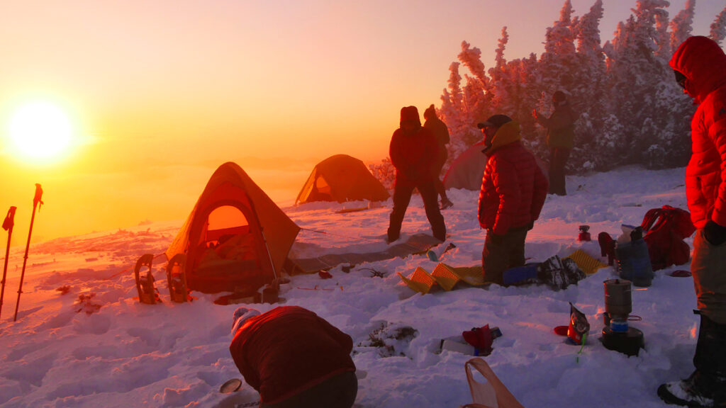 winter snow camp at sunset