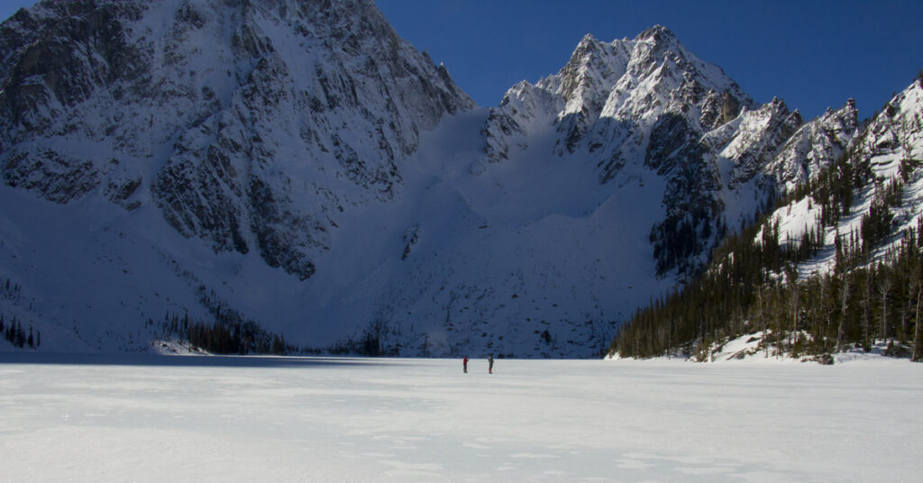 hiking on a frozen alpine lake